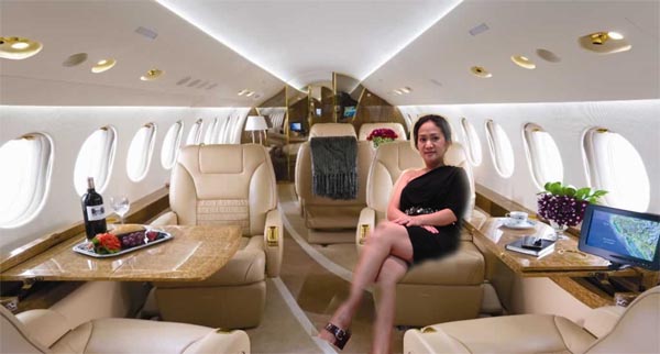 Rich woman sitting in a private jet