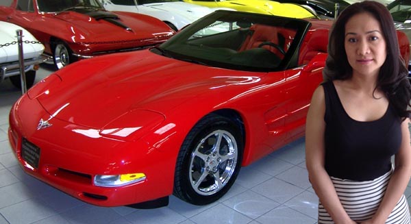 Beautiful lady and red corvette